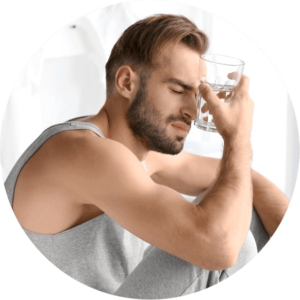 Morning of young man suffering from hangover at home