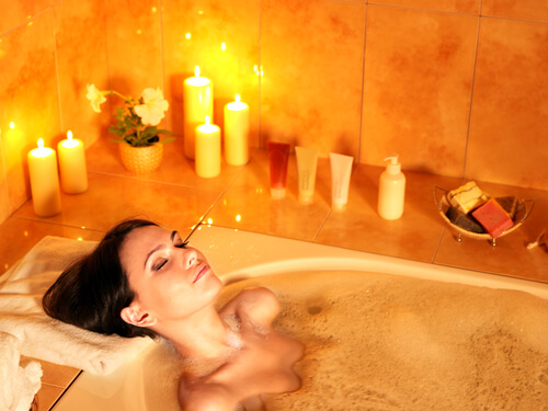 woman relaxed in hot bubble bath