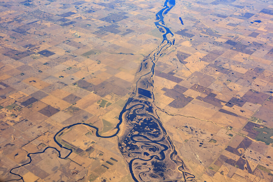 river and field near Minot and Logan, United States