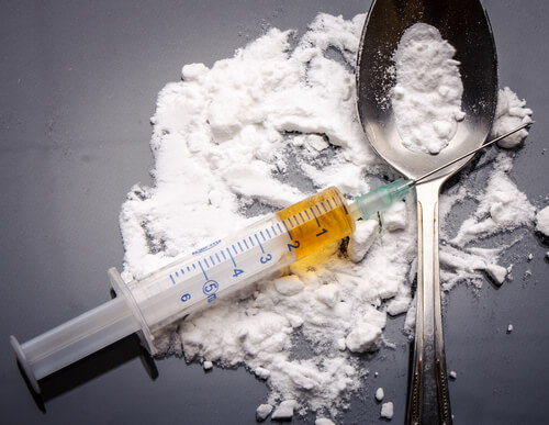 white powder and yellow liquid heroin