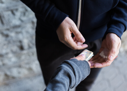 man buying flexril drugs on the streets