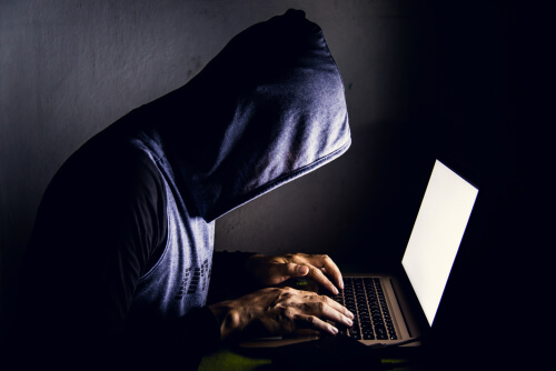 man searching for drugs in the dark web
