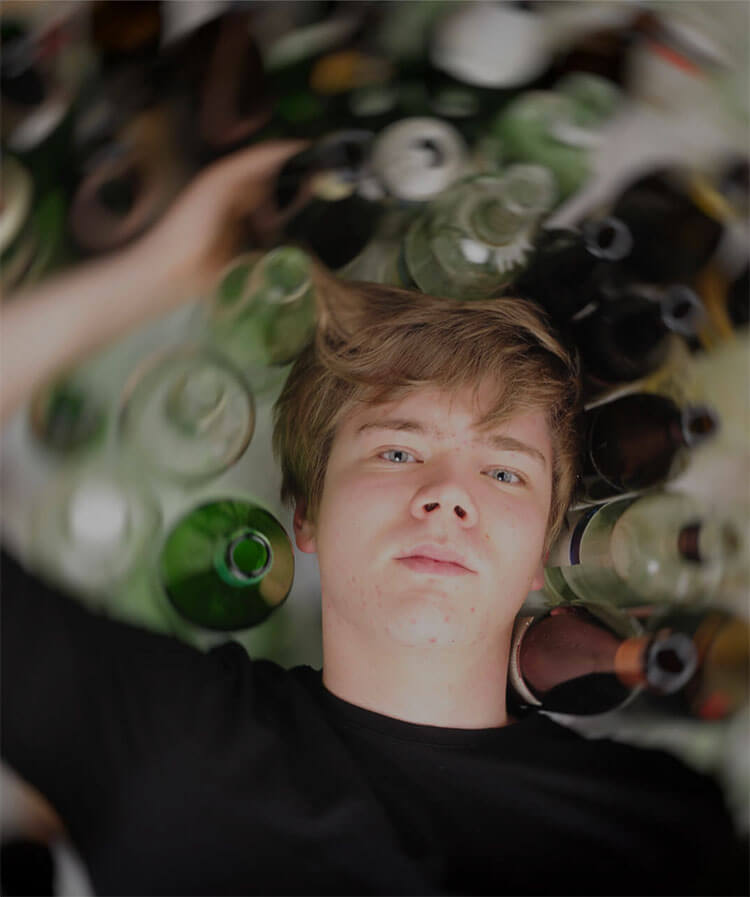 young-man-and-bottles-horizontal
