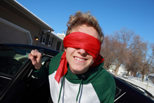 teen driving in a blindfold