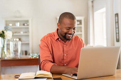 African american get access to NA online by computer.