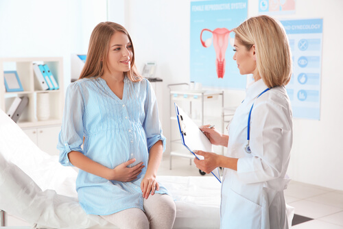 Doctor Consults Pregnant Woman