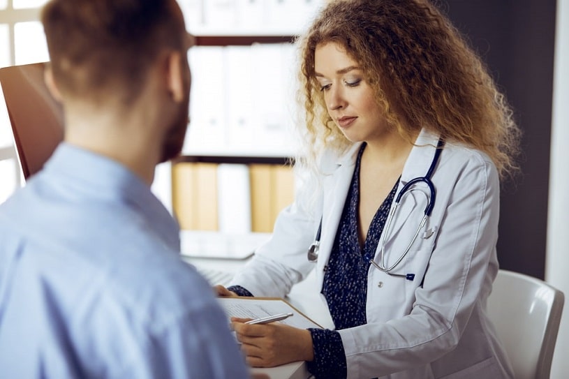 Doctor talks with patient about cocaine therapy.