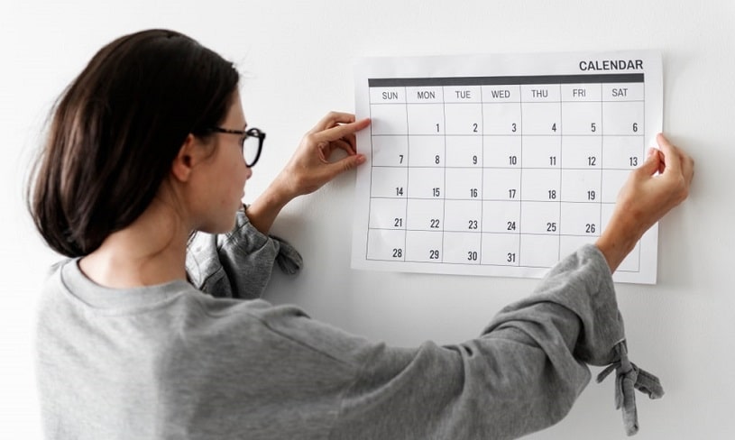 Woman checking her calendar.
