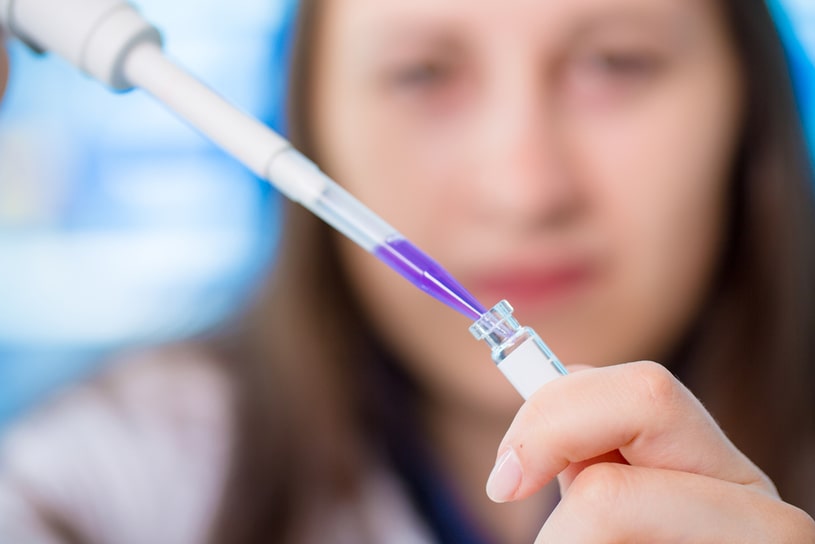 Young doctor makes a test in the laboratory. 