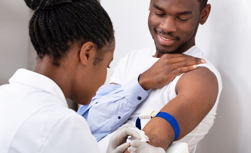 Doctor taking a blood sample for crack drug test.