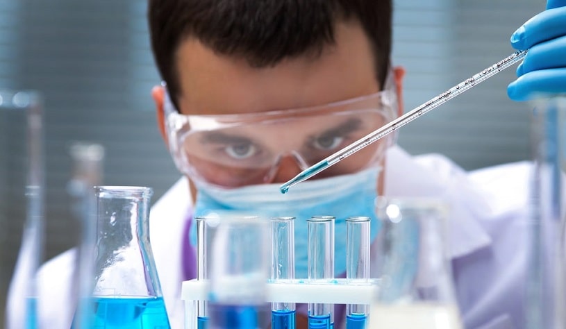 Lab worker checking samples.