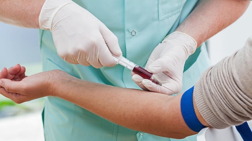 Nurse collecting blood for percocet drug test.