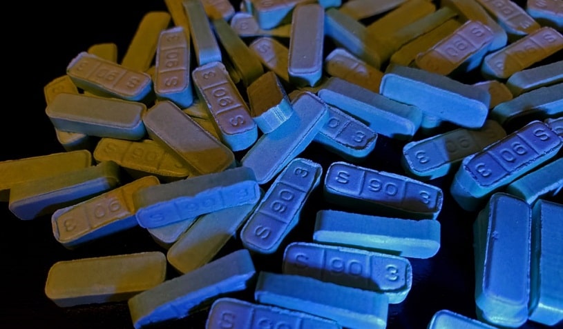 Xanax bars on black background.