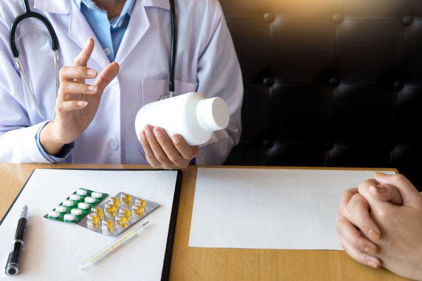 A doctor tells a patient what to do if Lexapro side effects occur.