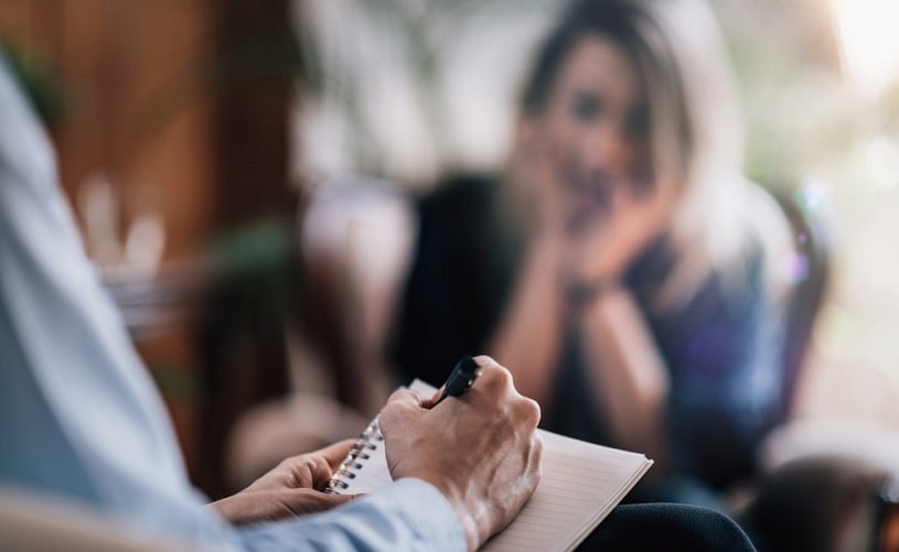 Female patient talking to psychologist.