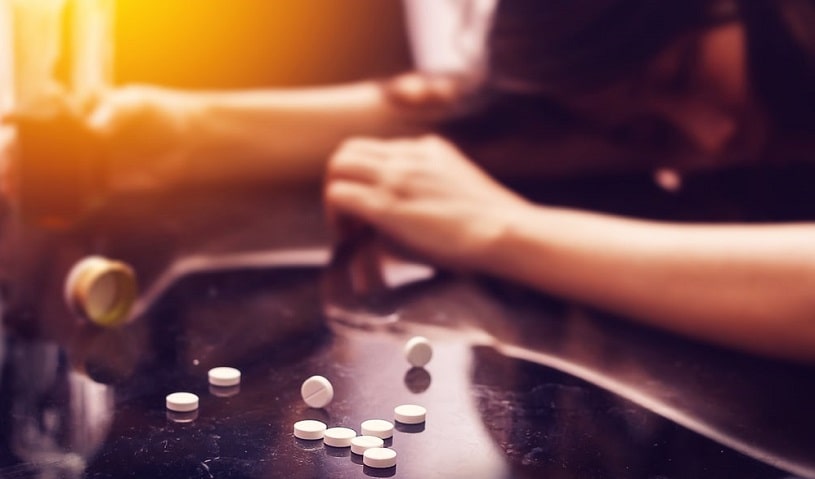 Overdose on Effexor pills, pills spilled on the table.
