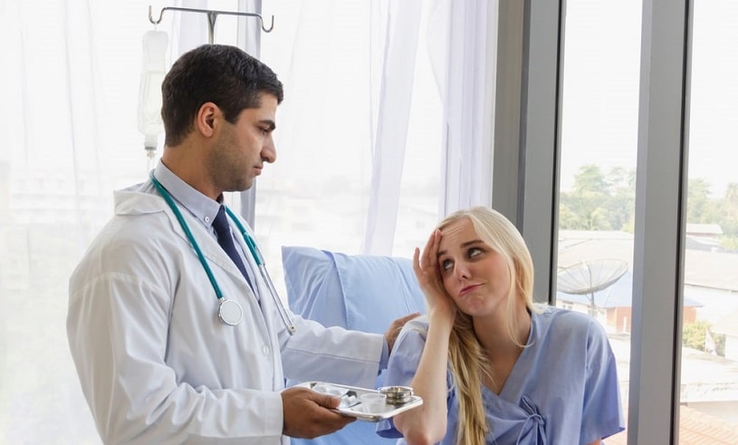 Doctor helping a patient after prozac overdose.