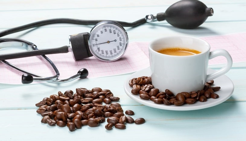 Coffee cup and beans next to the tonometer.