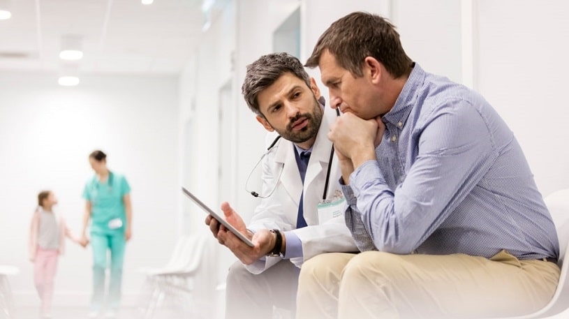 Doctor talking to a patient about opioid treatment.