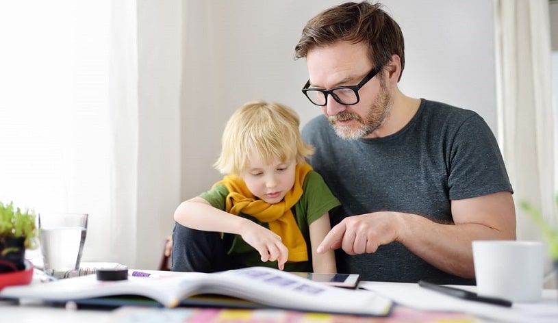 Father helping a child with ADHD.