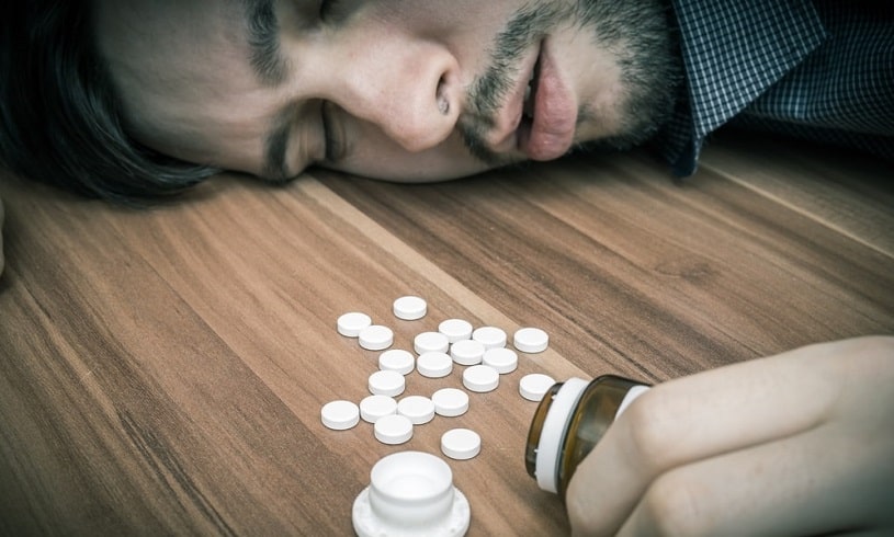 Man lying on the floor after overdose on Clonidine.