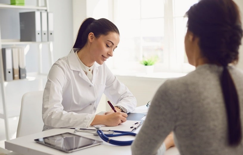 Woman patient discussing Cymbalta sexual side effects with doctor.