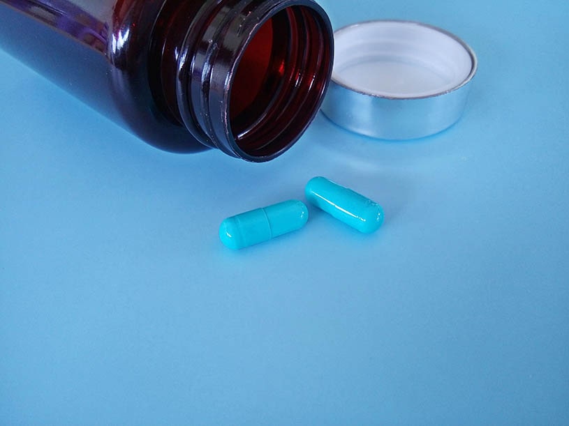 Blue pills on the blue backgdound.