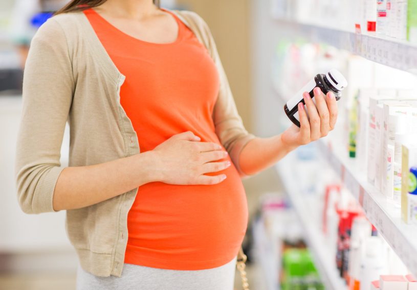 Pregnant woman in the pharmacy