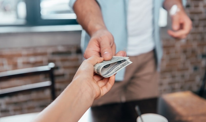 Man lending money to an addict, enabling his addiction.