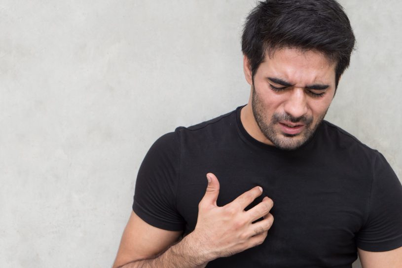 Man is suffering from reflux disease