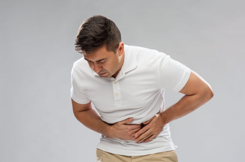 Man is suffering from the stomach pain