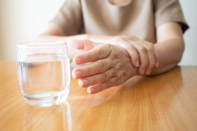Elderly woman hands with tremor