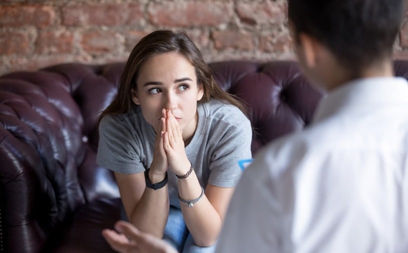 Worried woman talking to EMDR therapist.