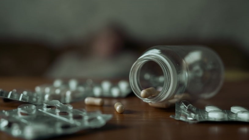 Bottle of pills on the table.