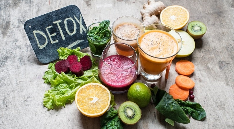 Detox vegerables, fruits and smoothies on the table.