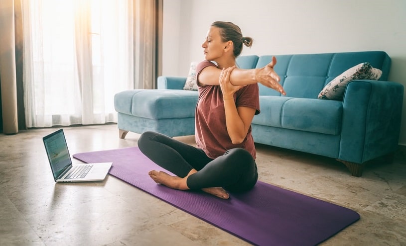 Woman practicing yoga for addiction recovery.